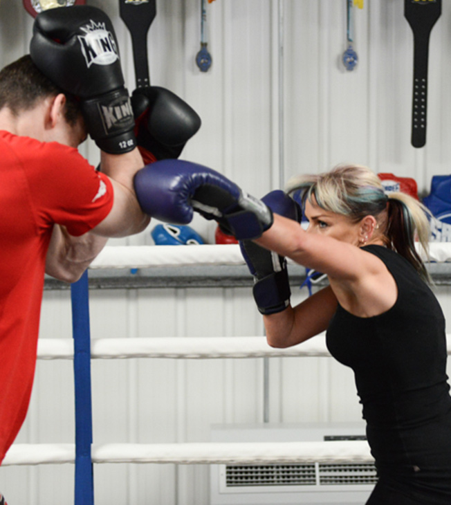 jacqui sparring with man in red shirt